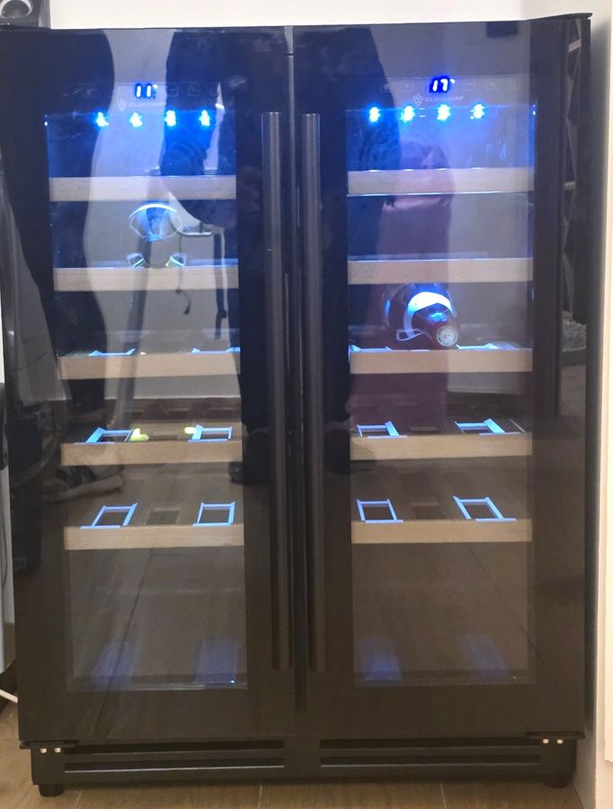 The two-zone service wine fridge in the laundry room